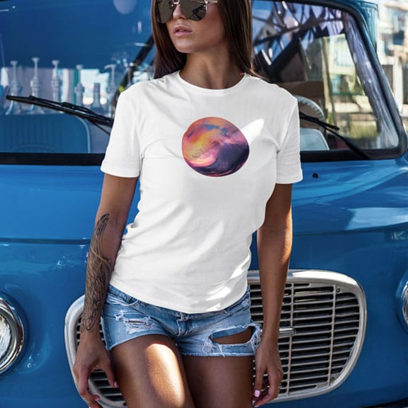 Woman wearing sunset wave circular white t-shirt for coming ocean sunrises and new beginnings.