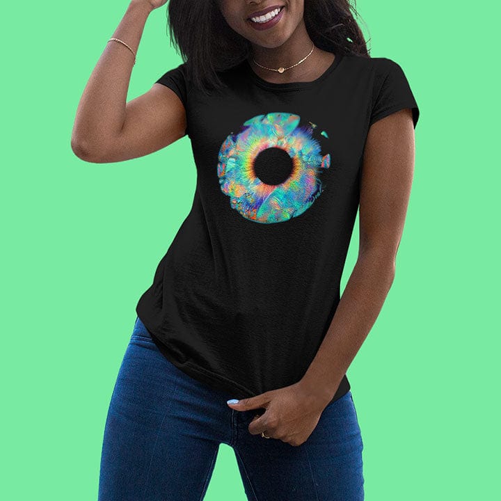 Woman wearing vibrant crystalline ring in rainbow iridescent tones black t-shirt for ethereal perception light bending dimensional awareness spiritual vision