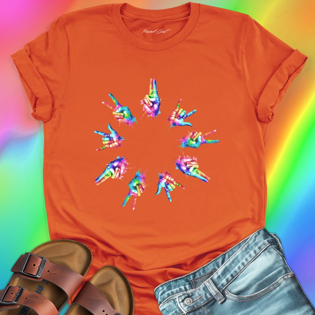 Rainbow tie-dye hands arranged in circle orange t-shirt for unity harmony peace community building spiritual connection inclusive love