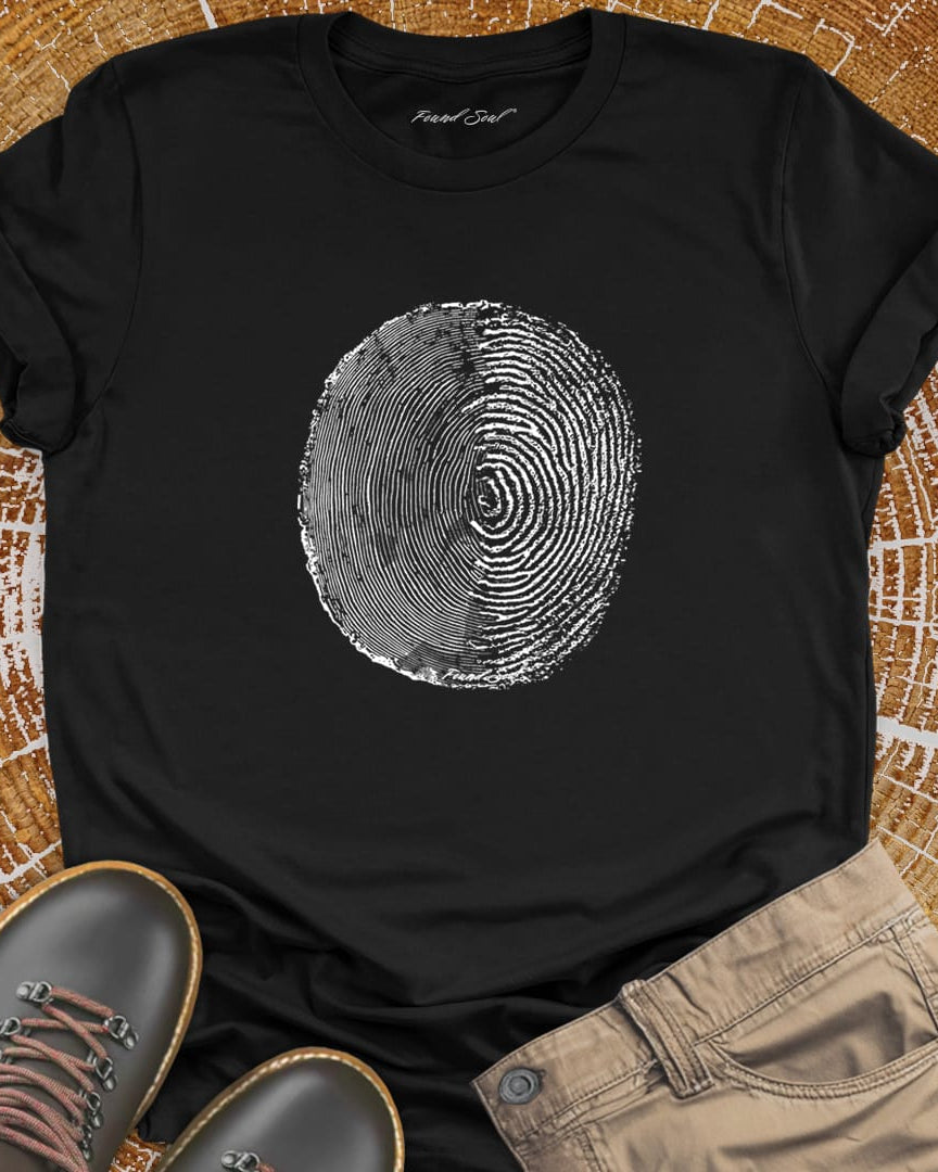 Tree ring and thumbprint design on black t-shirt for nature identity growth layers