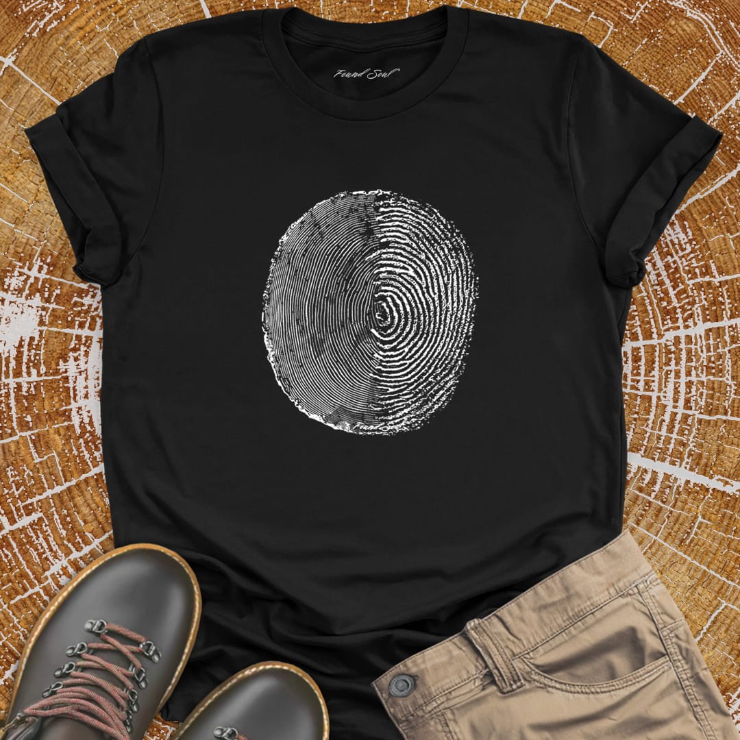 Tree ring and thumbprint design on black t-shirt for nature identity growth layers