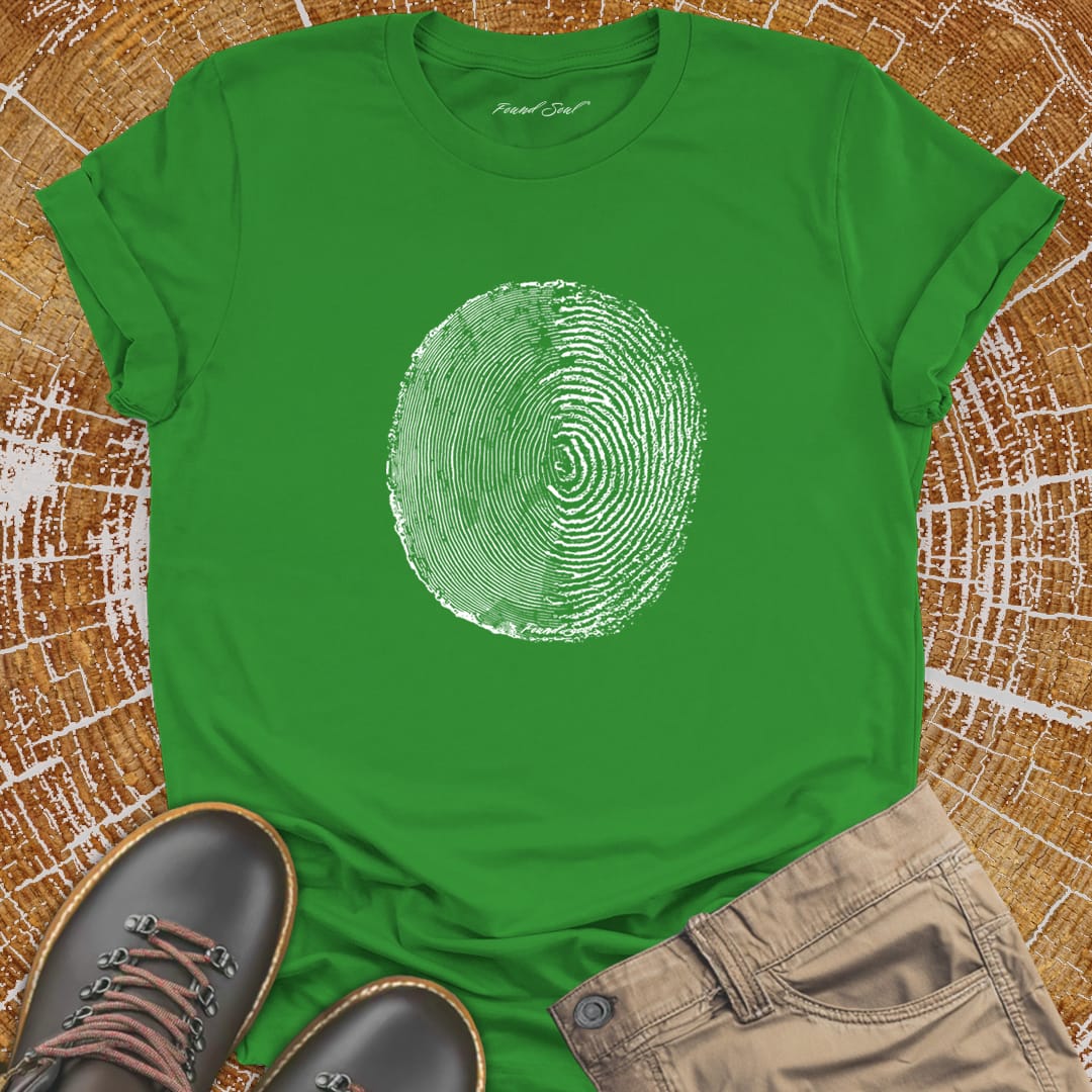 Tree ring and thumbprint design on green t-shirt for nature identity growth layers