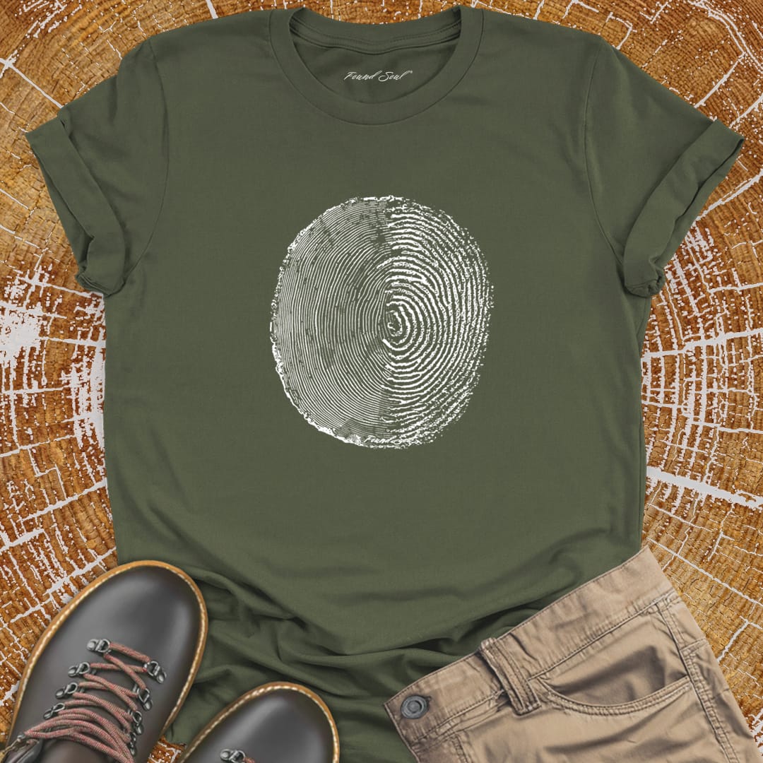 Tree ring and thumbprint design on olive green t-shirt for nature identity growth layers
