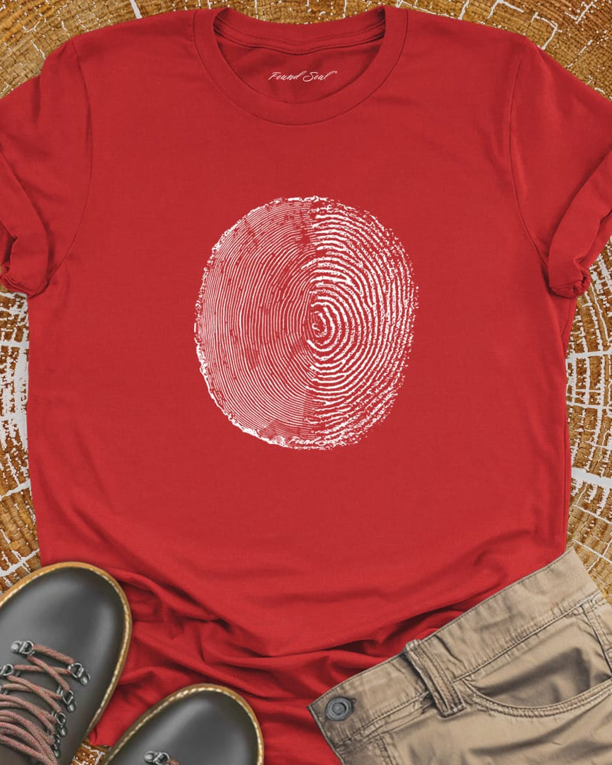 Tree ring and thumbprint design on red t-shirt for nature identity growth layers