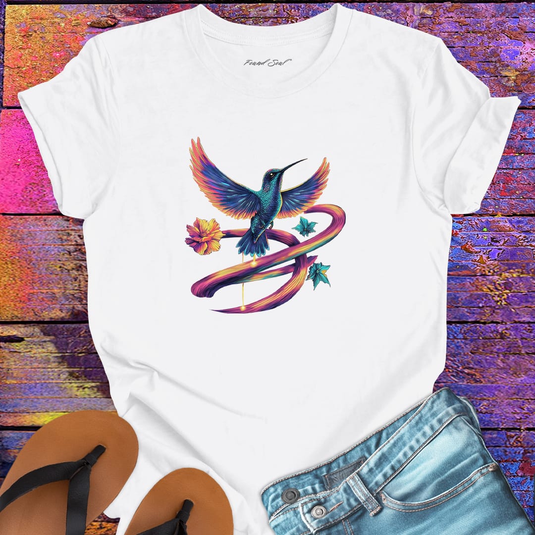 Vibrant hummingbird with flowing rainbow ribbon trails and flower white t-shirt for flow state movement art presence spiritual beauty