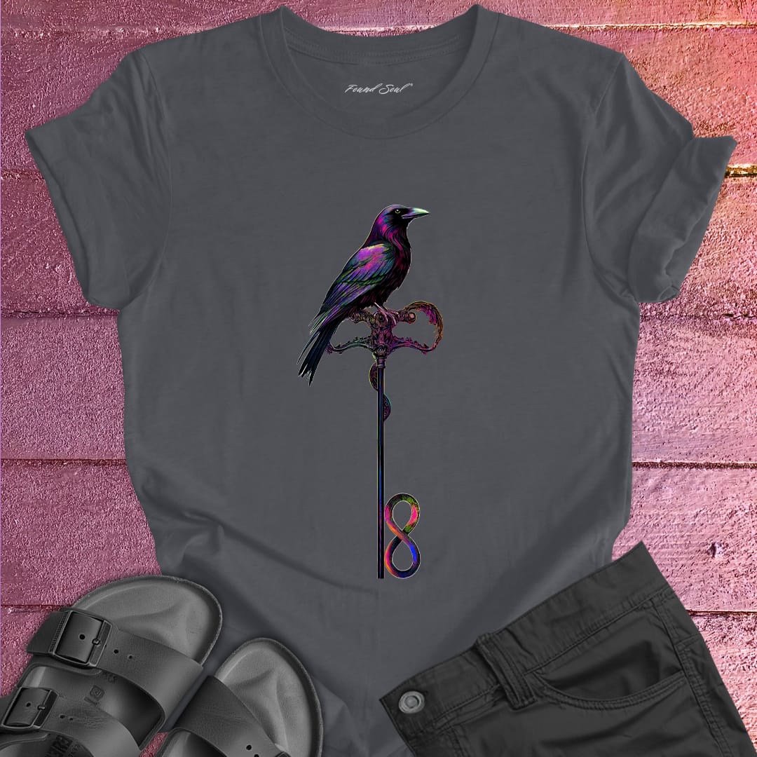 Vibrant bird perched on infinity symbol key on grey t-shirt for freedom access unlocking infinity spiritual liberation key