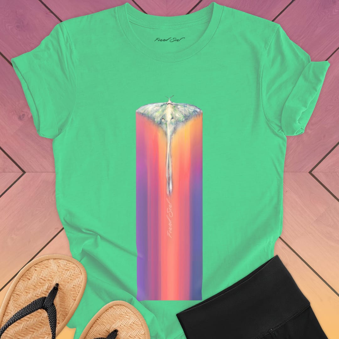 Luminous moth with extended wings gliding through green t-shirt for lunar journey frequency travel spiritual transition