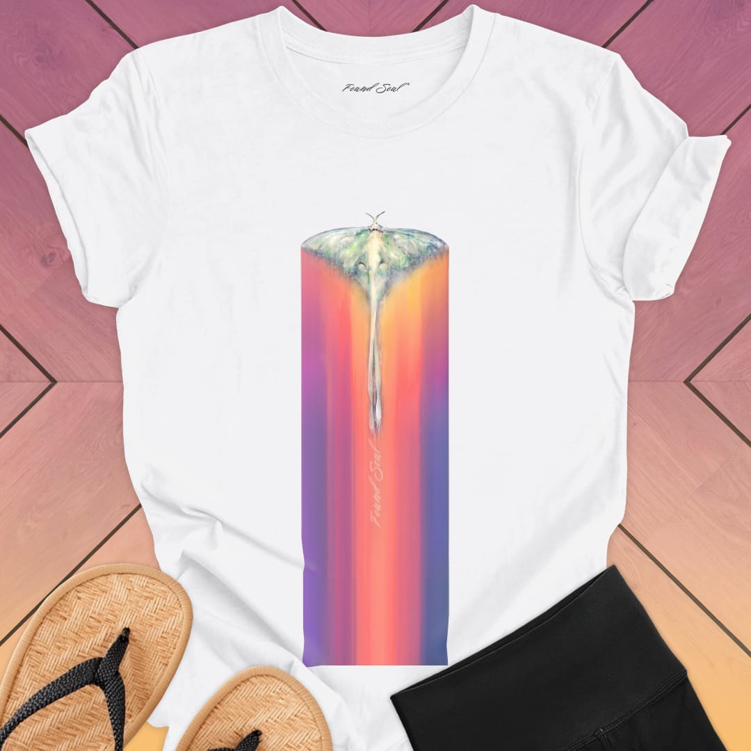 Luminous moth with extended wings gliding through white t-shirt for lunar journey frequency travel spiritual transition