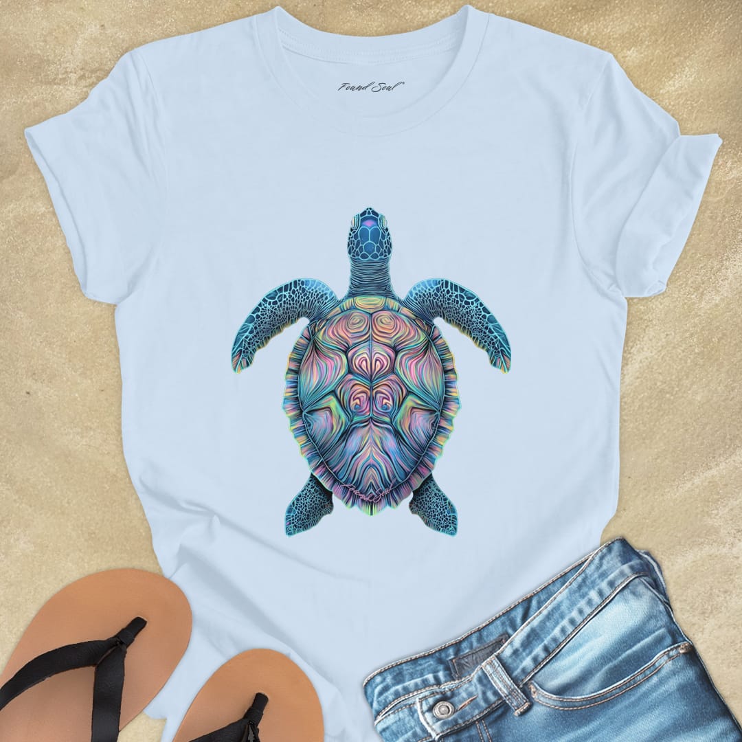 Mosaic sea turtle vibrant patterns light blue t-shirt for patience and sacred journeys.
