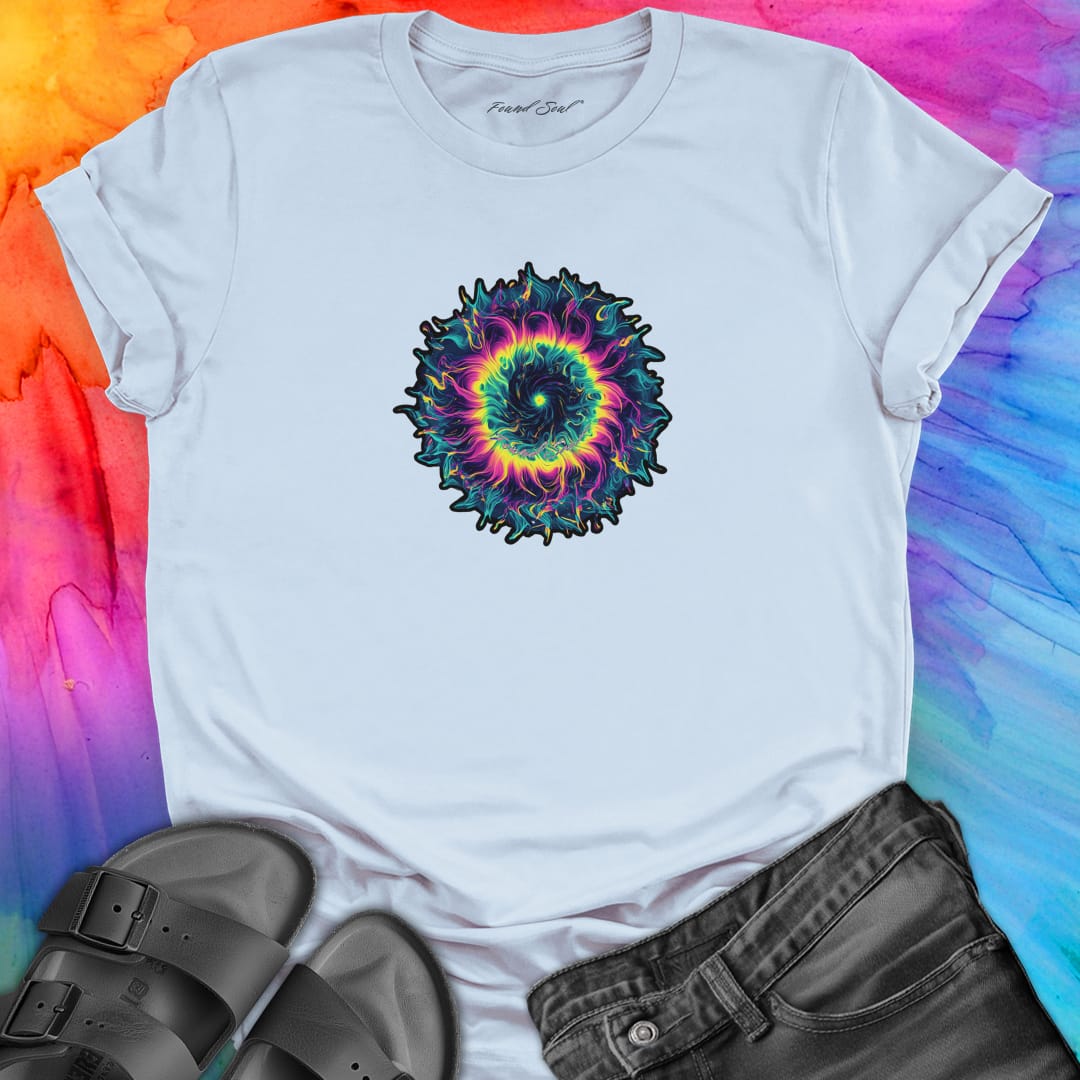 Vibrant rainbow and black spiral mandala on light blue t-shirt for energy frequency.