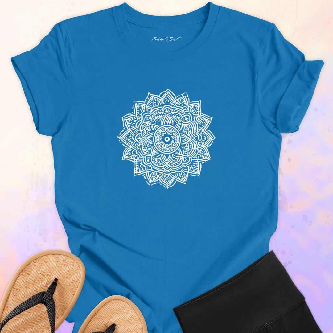 Mandala with delicate petal symmetry on blue t-shirt for meditation consciousness expansion sacred geometry
