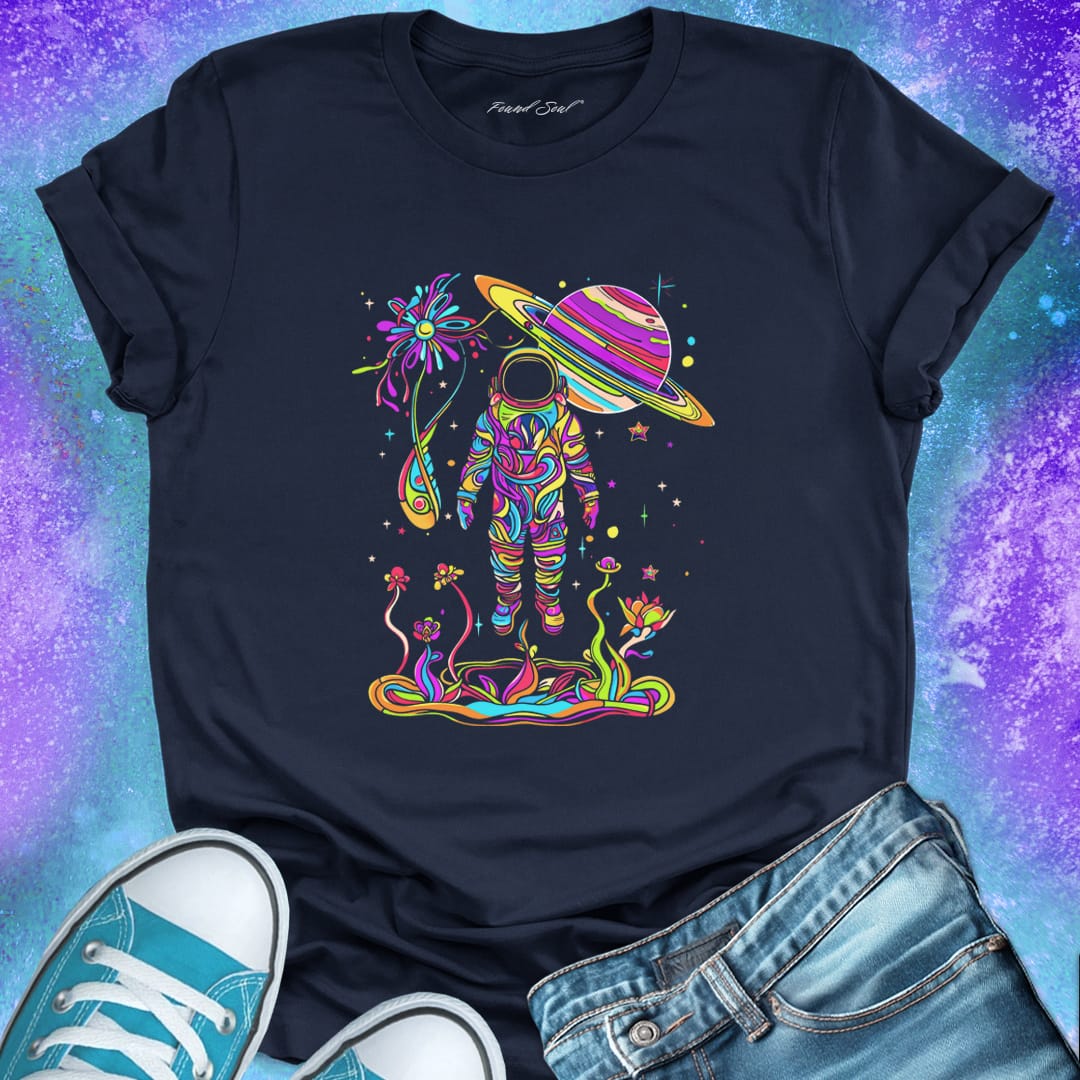 Astronaut in vibrant rainbow garden with Saturn planet above on nay t-shirt for cosmic nature mysticism.