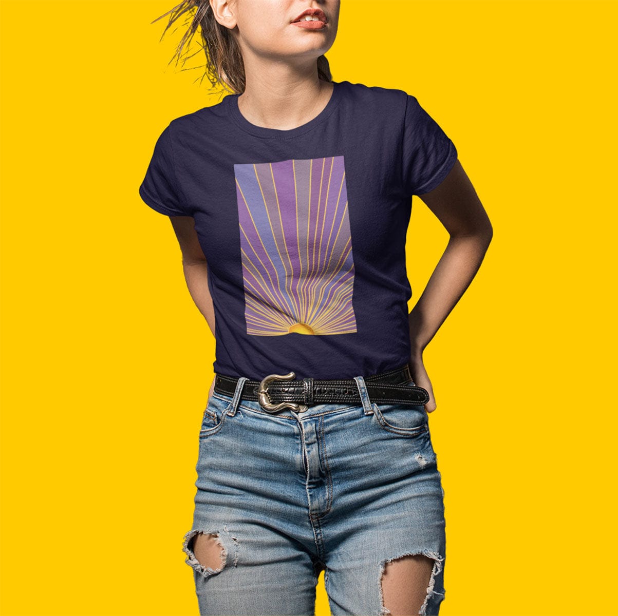Woman wearing sunrise with radiating rays in purple and gold navy t-shirt for dawn watching infinite potential morning ritual