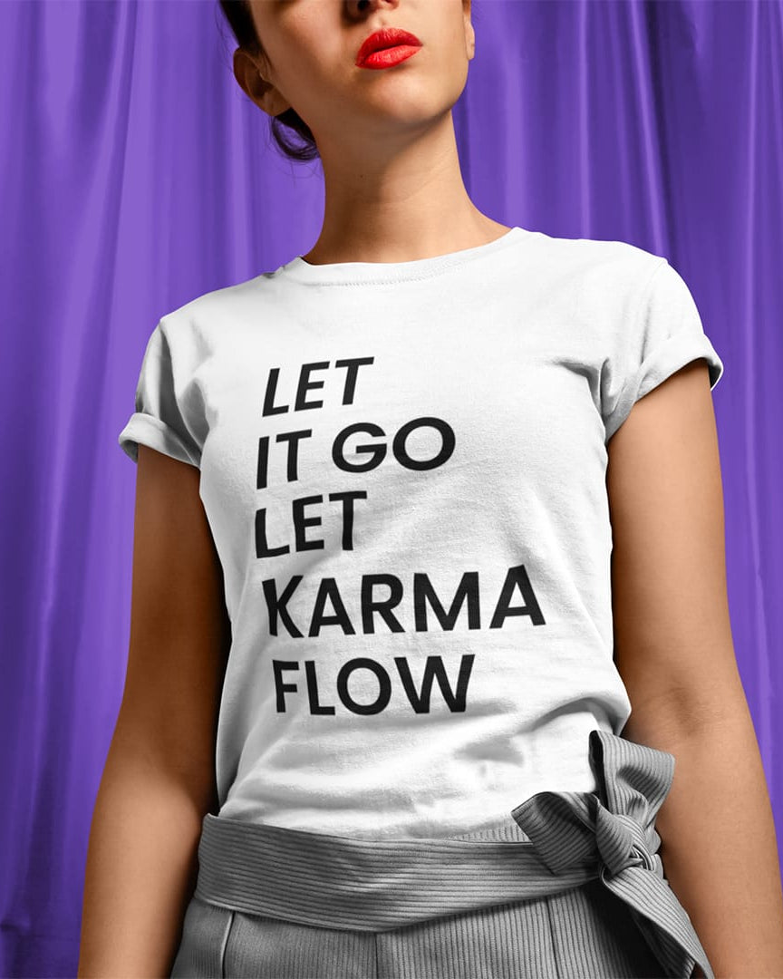 Woman wearing let it go let karma flow white t-shirt for release and trust.