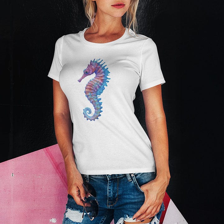 Woman wearing purple and blue seahorse white t-shirt for gentle strength and ocean grace.