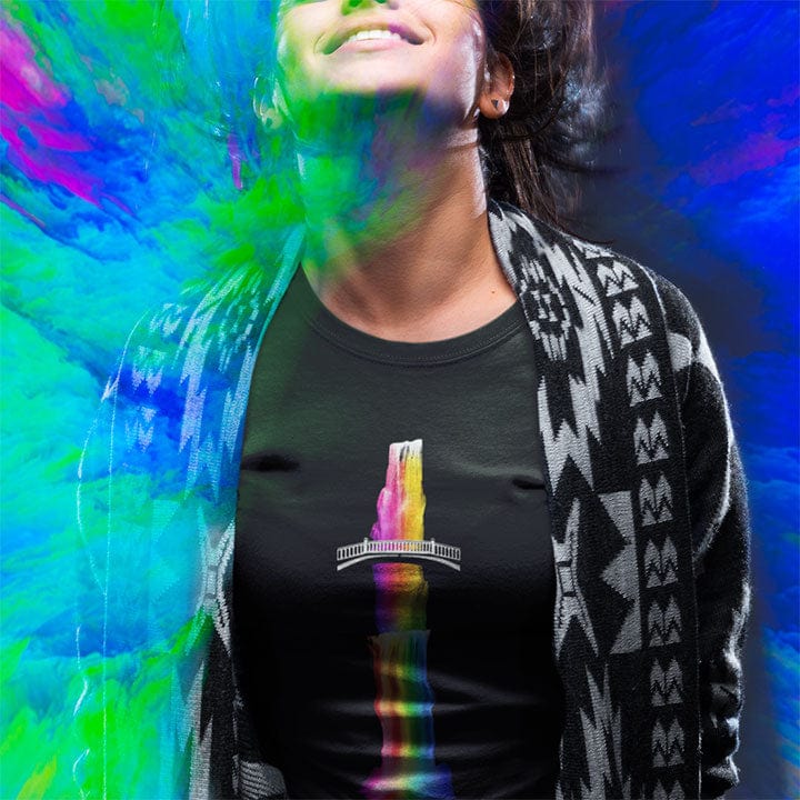 Woman wearing vibrant rainbow waterfall over bridge black t-shirt for rainbow cascade overflow generosity pouring building bridges spiritual sharing flow