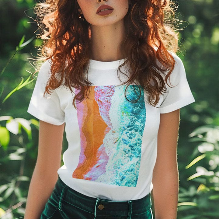 Woman wearing beach and waves surf blend white t-shirt for healing and coastal peace.