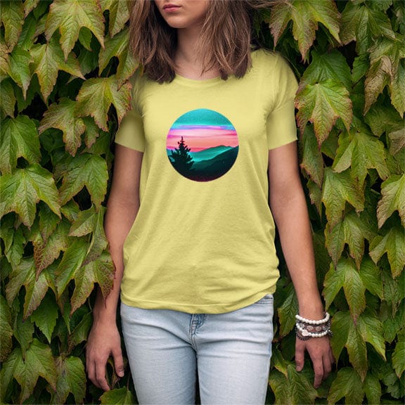 Woman wearing silhouetted mountain ridges on yellow t-shirt for mountain meditation stillness nature communion