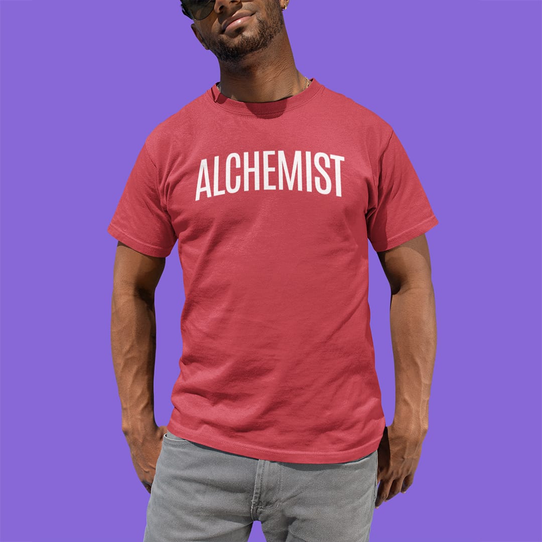 Man wearing Alchemist red t-shirt for transformation and personal alchemy.