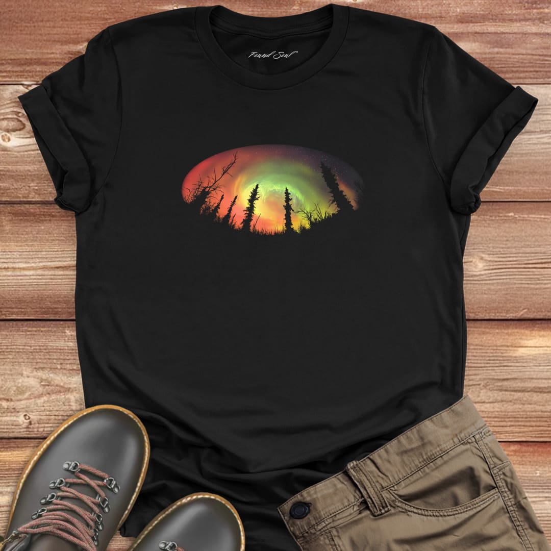 Forest silhouette in front of aurora on black t-shirt for nature mysticism earth sky connection.