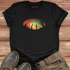 Forest silhouette in front of aurora on black t-shirt for nature mysticism earth sky connection.