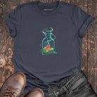 Glowing bottle with swirling cosmic magic on grey t-shirt for boundless energy contained magic spiritual defiance