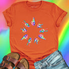 Rainbow tie-dye hands arranged in circle orange t-shirt for unity harmony peace community building spiritual connection inclusive love