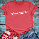 Red compassion t-shirt.