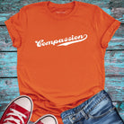 Orange compassion t-shirt.