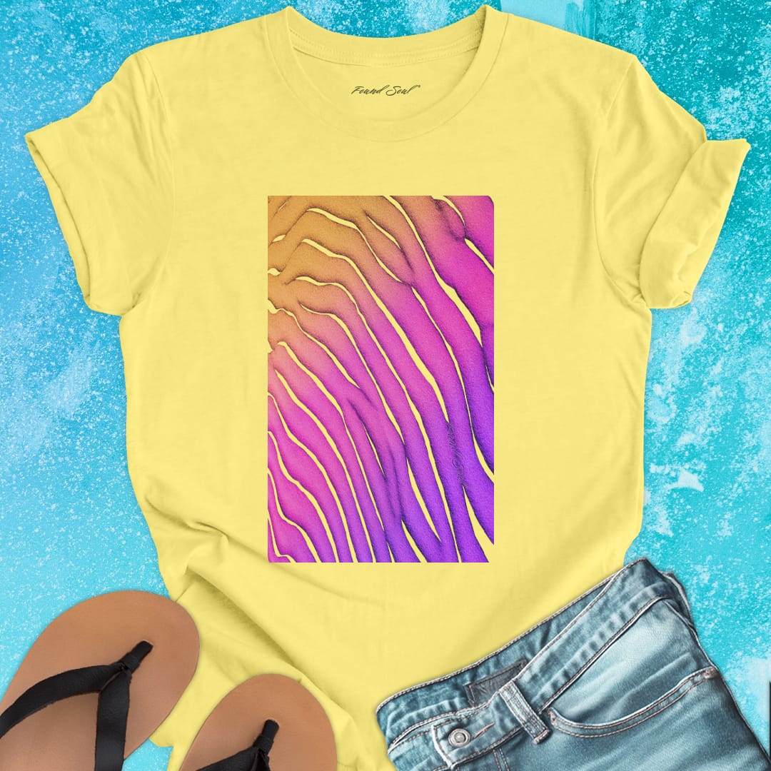 Flowing wave patterns etched in sand yellow t-shirt for water signature sand memory imprint flow spiritual marking