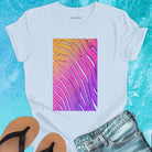 Flowing wave patterns etched in sand light blue t-shirt for water signature sand memory imprint flow spiritual marking