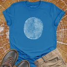 Tree ring and thumbprint design on blue t-shirt for nature identity growth layers