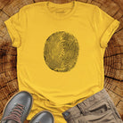 Tree ring and thumbprint design in white on yellow t-shirt for nature identity growth layers spiritual connection