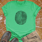Tree ring and thumbprint design in white on green t-shirt for nature identity growth layers spiritual connection