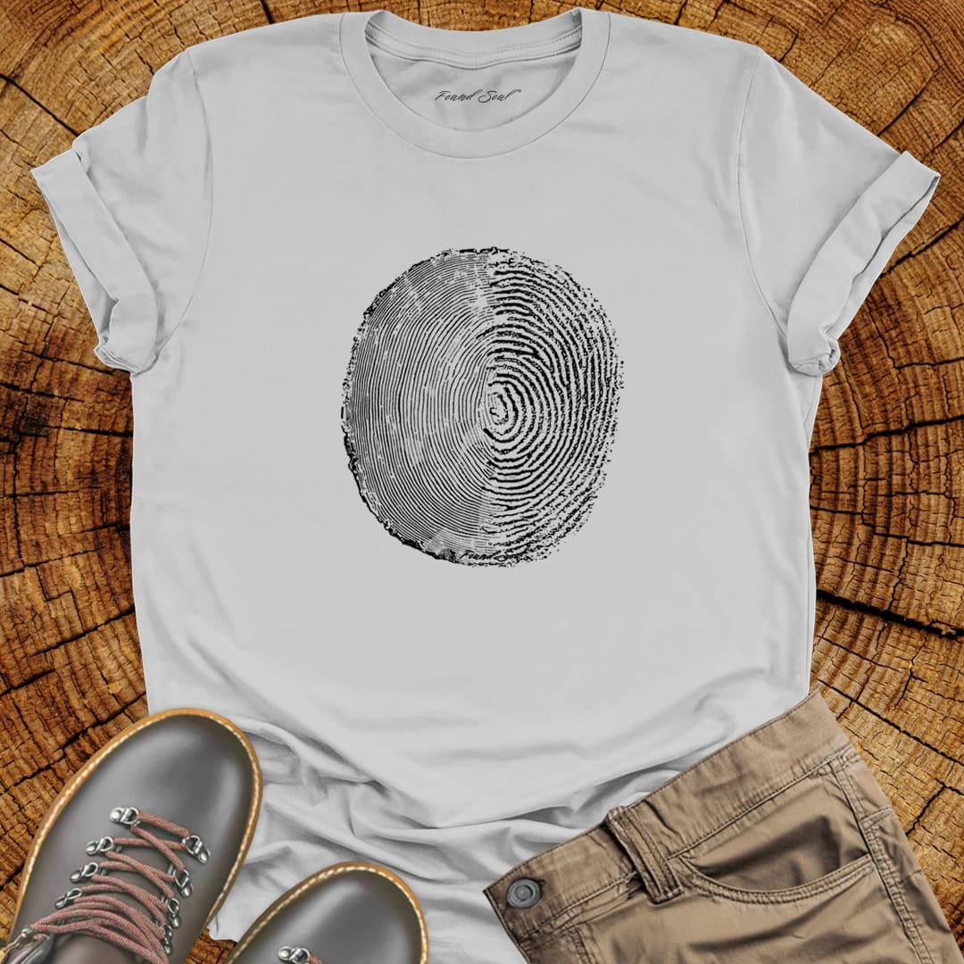 Tree ring and thumbprint design in white on ice grey t-shirt for nature identity growth layers spiritual connection