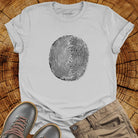 Tree ring and thumbprint design in white on ice grey t-shirt for nature identity growth layers spiritual connection