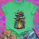 Iridescent purple green gold mushroom cluster with glowing mycelium green t-shirt.