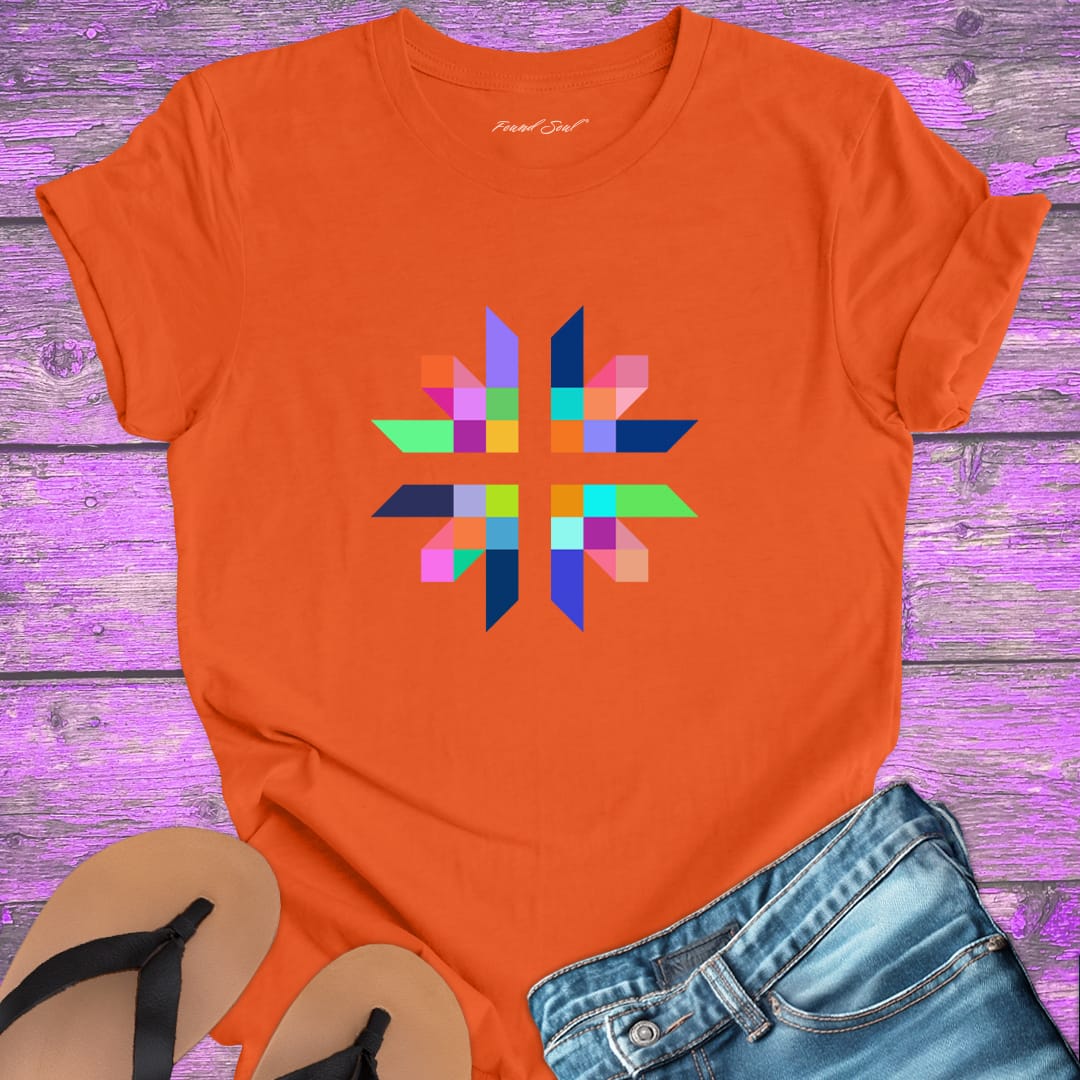 Intricate geometric star with intersecting pathways on orange t-shirt for sacred geometry alignment energetic flow