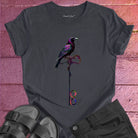 Vibrant bird perched on infinity symbol key on dark grey t-shirt for freedom access unlocking infinity spiritual liberation key
