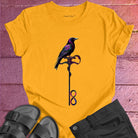 Vibrant bird perched on infinity symbol key on yellow t-shirt for freedom access unlocking infinity spiritual liberation key
