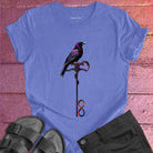 Vibrant bird perched on infinity symbol key on purple t-shirt for freedom access unlocking infinity spiritual liberation key