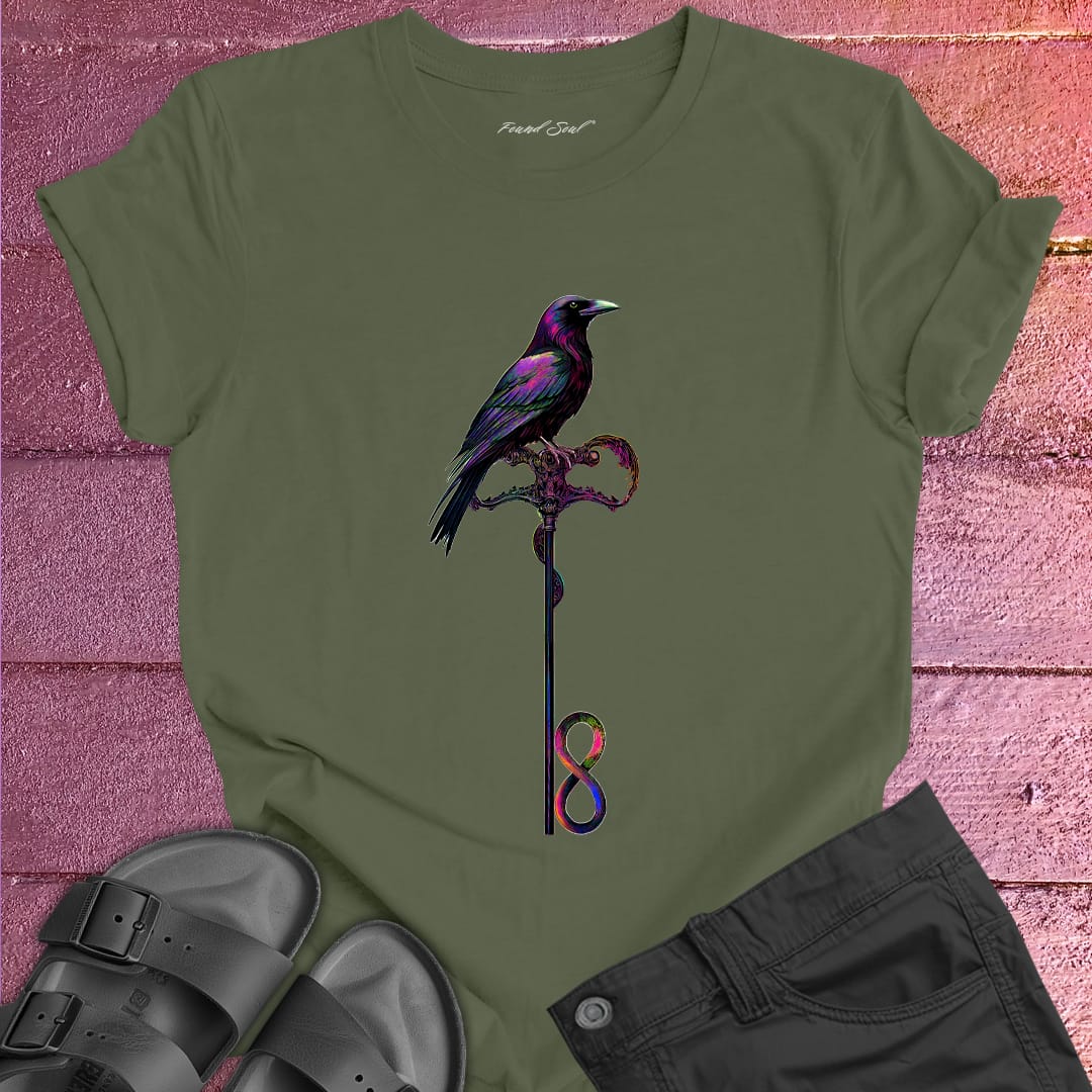 Vibrant bird perched on infinity symbol key on olive green t-shirt for freedom access unlocking infinity spiritual liberation key