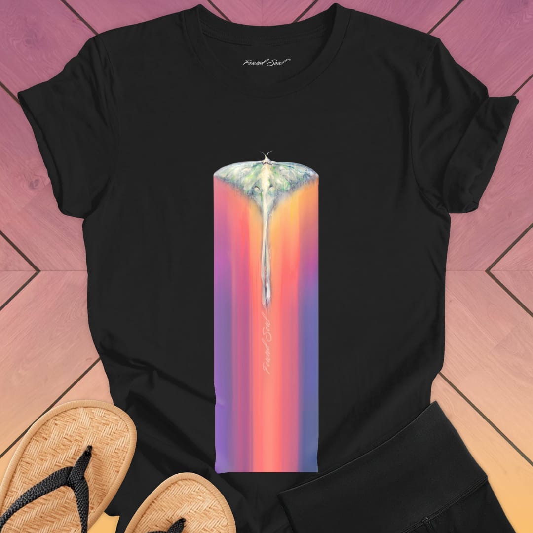Luminous moth with extended wings gliding through black t-shirt for lunar journey frequency travel spiritual transition