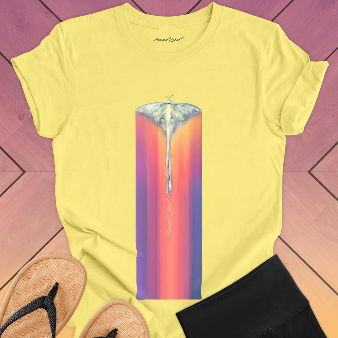 Luminous moth with extended wings gliding through yellow t-shirt for lunar journey frequency travel spiritual transition