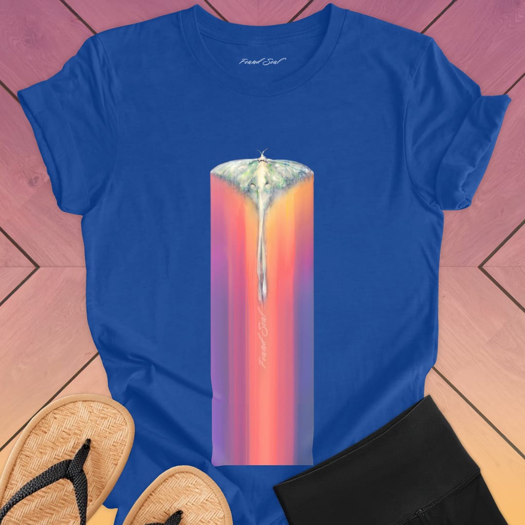 Luminous moth with extended wings gliding through blue t-shirt for lunar journey frequency travel spiritual transition