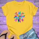 Vibrant mosaic geometric star with colorful angular pieces on yellow t-shirt for healing wholeness transformation sacred geometry
