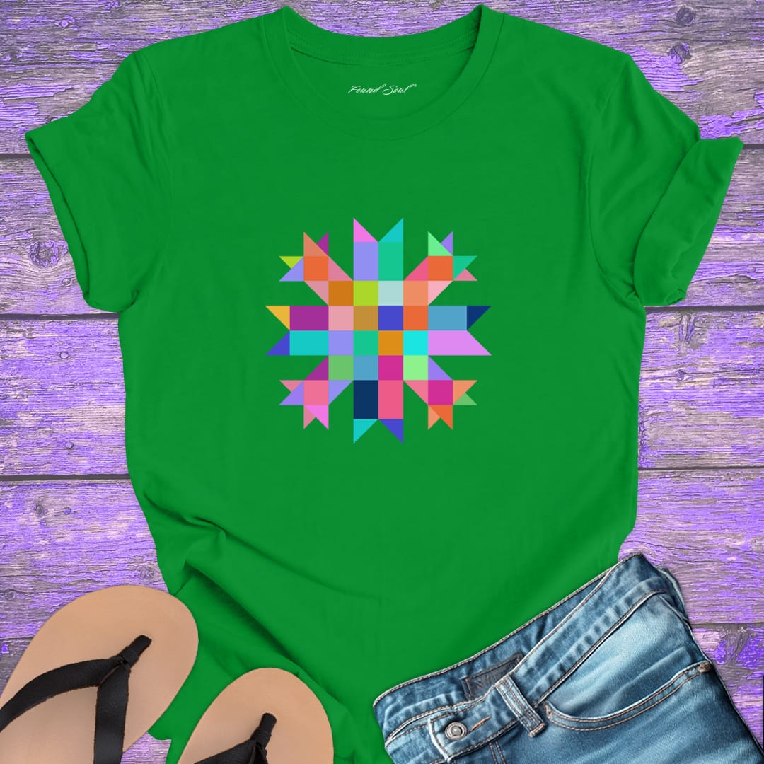 Vibrant mosaic geometric star with colorful angular pieces on green t-shirt for healing wholeness transformation sacred geometry