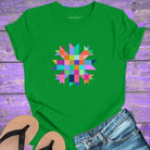 Vibrant mosaic geometric star with colorful angular pieces on green t-shirt for healing wholeness transformation sacred geometry