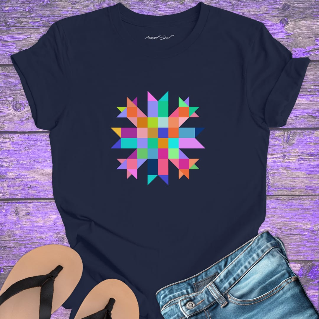 Vibrant mosaic geometric star with colorful angular pieces on navy t-shirt for healing wholeness transformation sacred geometry