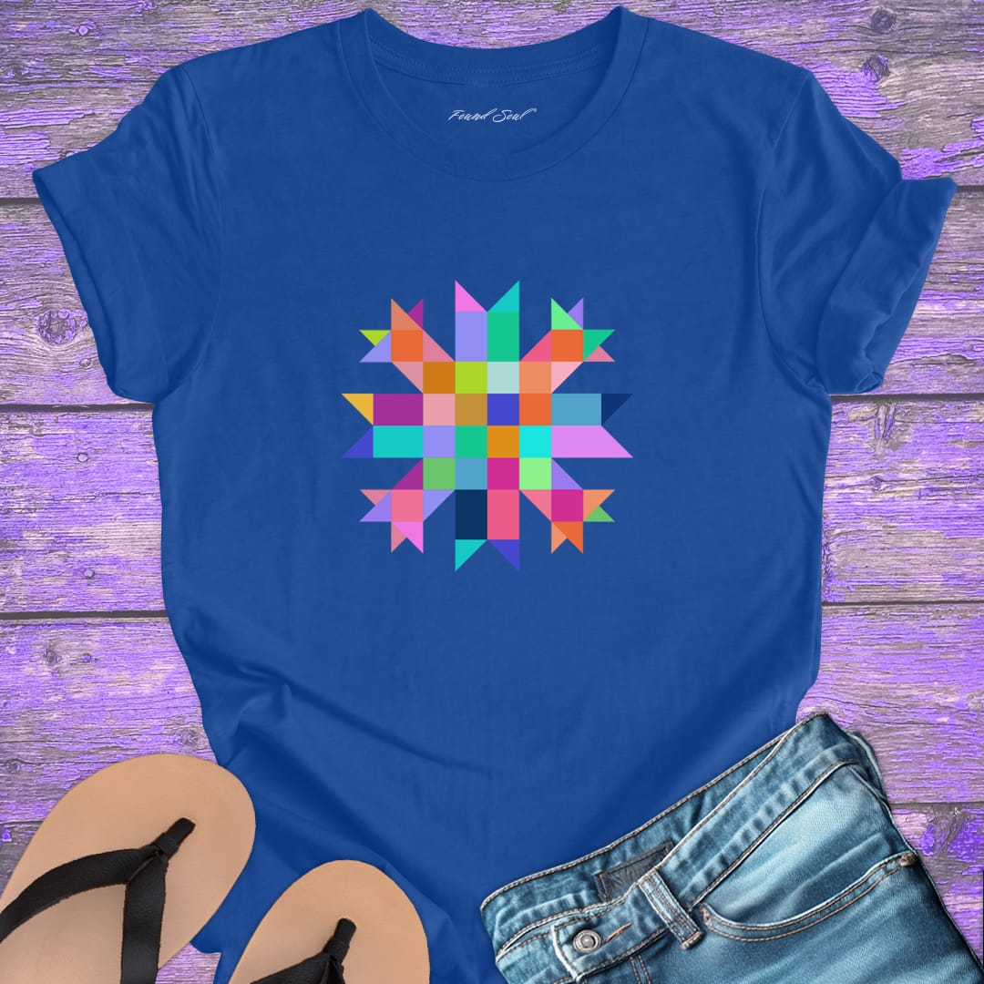 Vibrant mosaic geometric star with colorful angular pieces on blue t-shirt for healing wholeness transformation sacred geometry